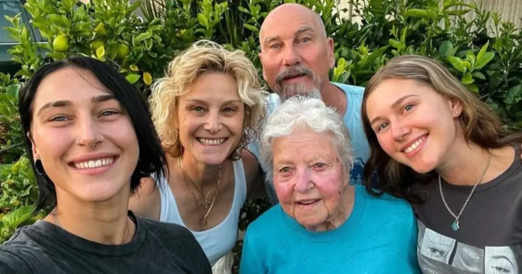 Rhea Ripley taking selfie with her father and mother